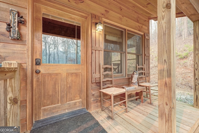 view of exterior entry with a porch