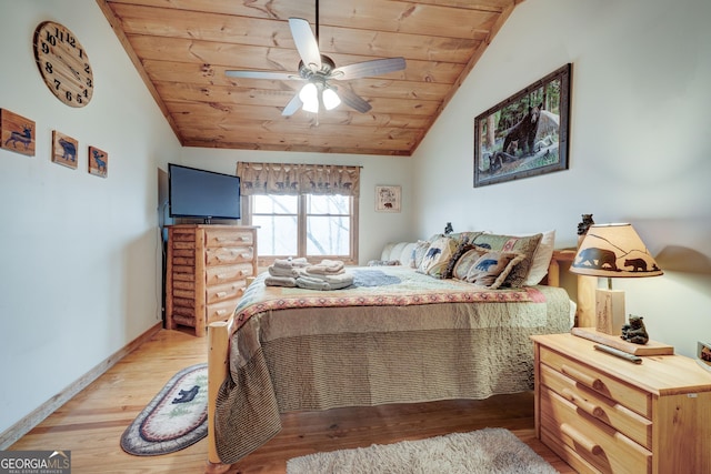 bedroom with wooden ceiling, vaulted ceiling, wood finished floors, baseboards, and a ceiling fan