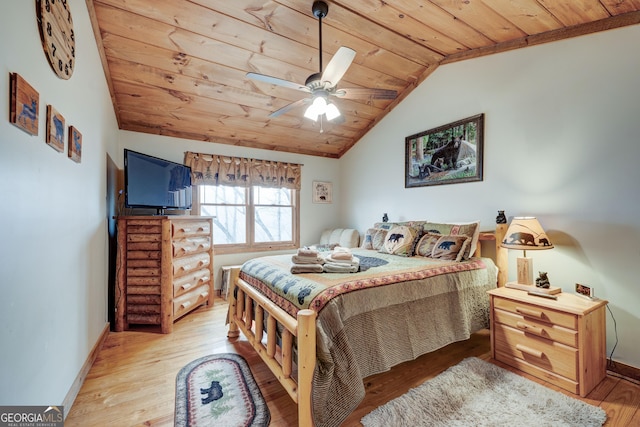 bedroom featuring wooden ceiling, baseboards, wood-type flooring, and vaulted ceiling