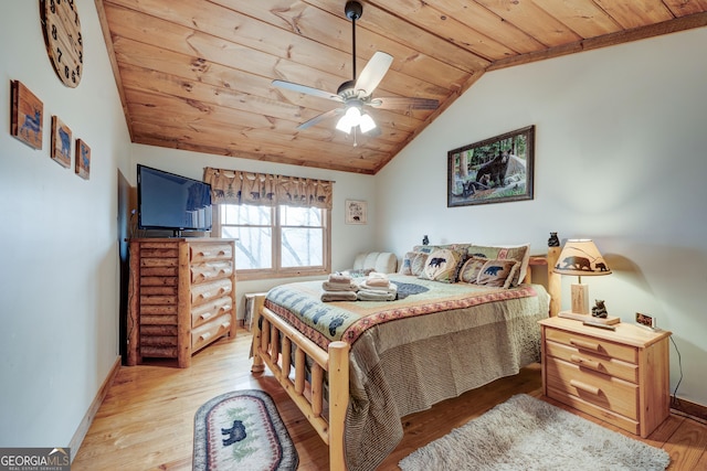 bedroom featuring wooden ceiling, vaulted ceiling, light wood finished floors, baseboards, and ceiling fan