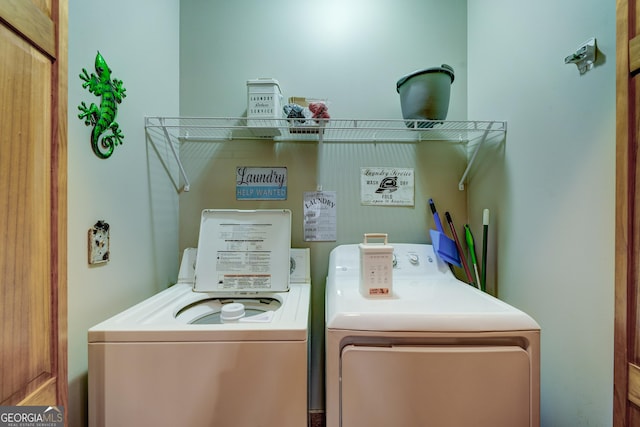 clothes washing area with laundry area and washer and clothes dryer