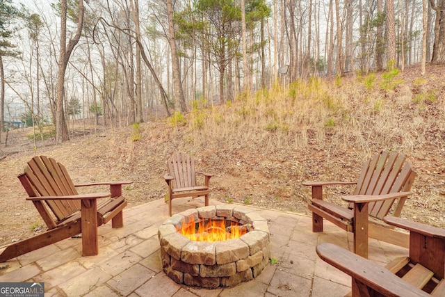 view of patio / terrace featuring a fire pit