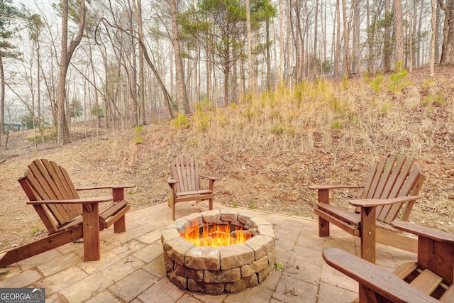 view of patio with a fire pit