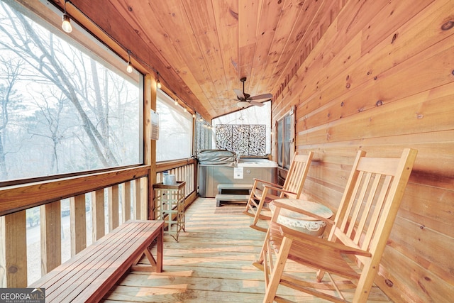 wooden terrace with a hot tub and ceiling fan