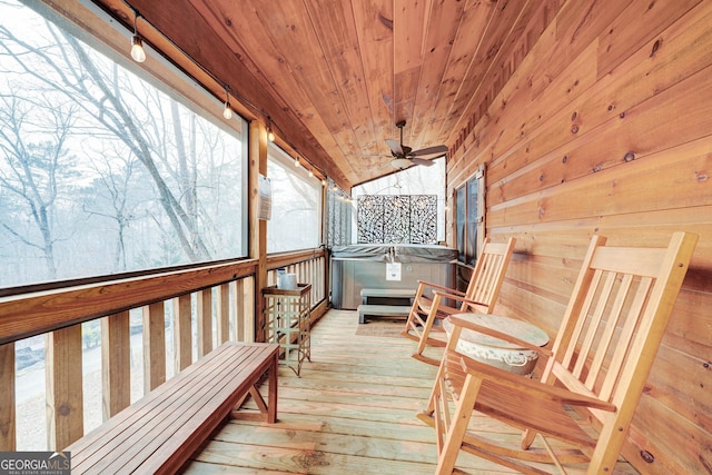 deck featuring a hot tub and ceiling fan