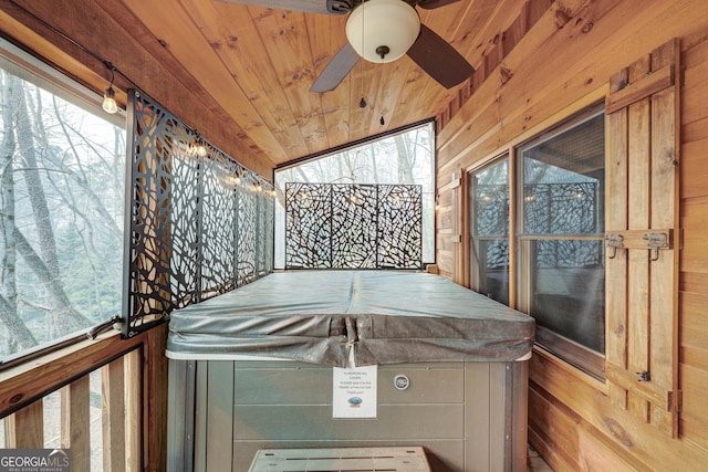 exterior space featuring wooden ceiling and ceiling fan