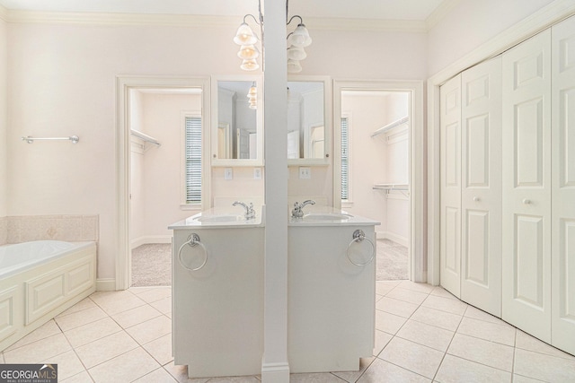 full bathroom with tile patterned floors, a bath, crown molding, and a closet