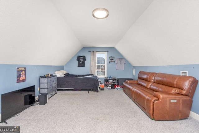 carpeted bedroom with visible vents and lofted ceiling