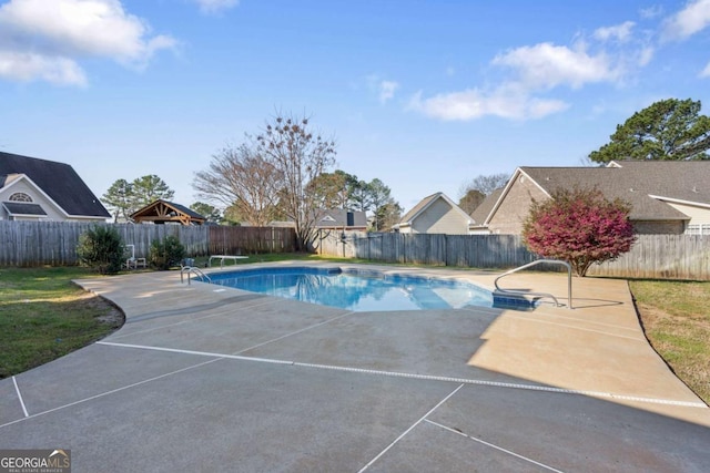 view of pool with a patio area, a fenced in pool, and a fenced backyard