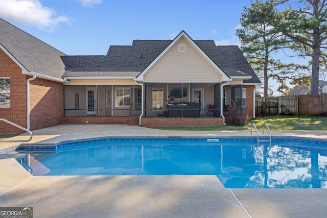 view of swimming pool featuring a fenced in pool, a patio, and fence