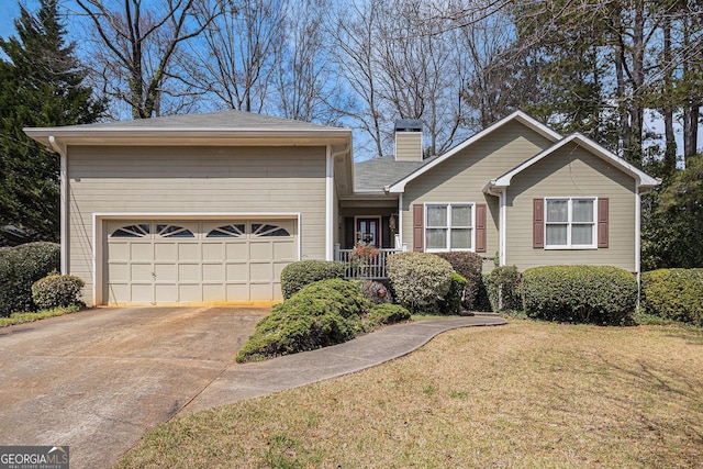 view of front of property with a front lawn, an attached garage, driveway, and a chimney