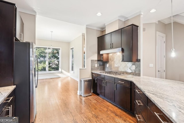 1199 Huff Rd Unit 121, Atlanta, GA 30318 - kitchen with appliances with stainless steel finishes, light wood finished floors, tasteful backsplash, light stone countertops, and recessed lighting
