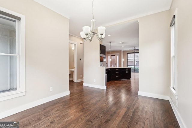 1199 Huff Rd Unit 121, Atlanta, GA 30318 - unfurnished dining area featuring a chandelier, dark wood-type flooring, and a ceiling fan