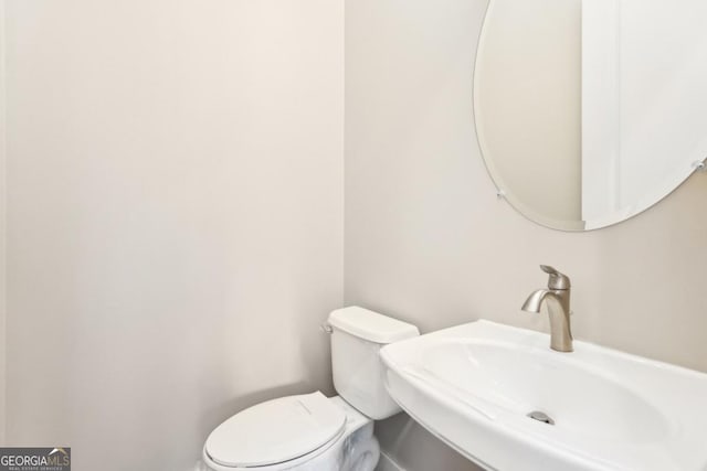 1199 Huff Rd Unit 121, Atlanta, GA 30318 - half bath with a sink and toilet