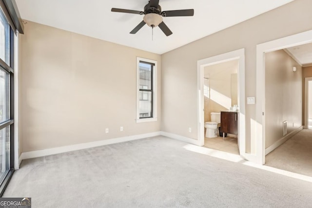 1199 Huff Rd Unit 121, Atlanta, GA 30318 - unfurnished bedroom featuring carpet flooring, multiple windows, and ensuite bathroom