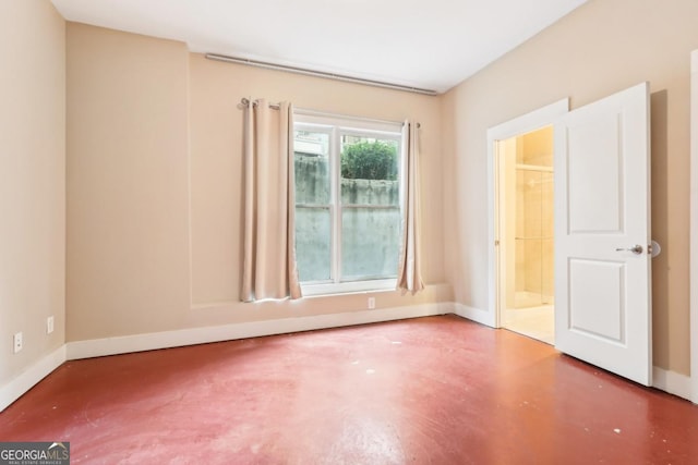 1199 Huff Rd Unit 121, Atlanta, GA 30318 - empty room featuring baseboards and concrete floors