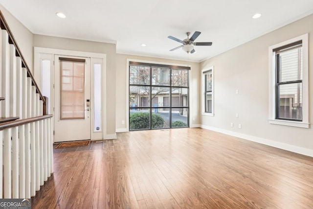 1199 Huff Rd Unit 121, Atlanta, GA 30318 - foyer entrance with wood finished floors, a ceiling fan, stairs, and recessed lighting