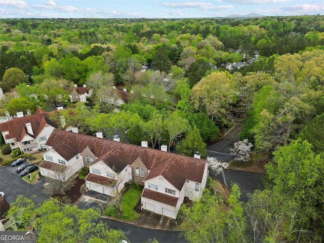 aerial view featuring a residential view and a view of trees