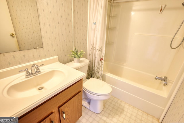 full bath with tile patterned floors, vanity, toilet, and shower / tub combo