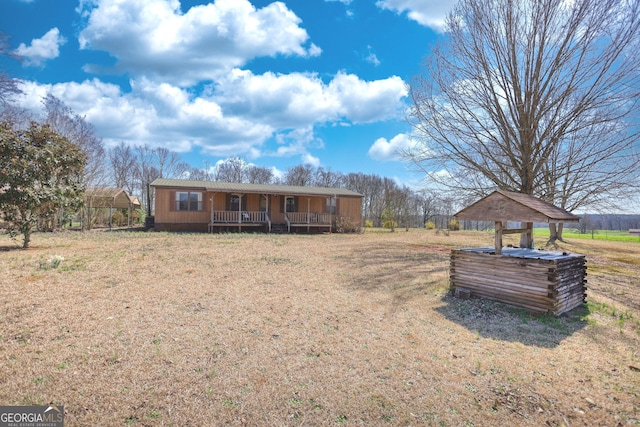 exterior space with a front lawn and covered porch