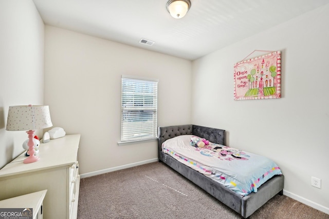 bedroom with visible vents, baseboards, and carpet