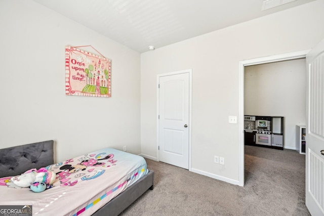 carpeted bedroom featuring visible vents and baseboards