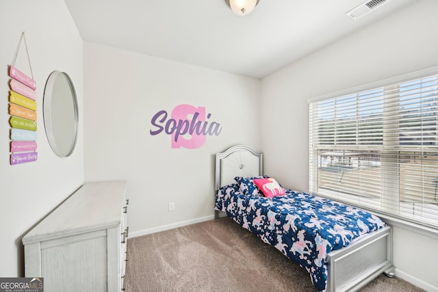 bedroom with visible vents, baseboards, and carpet