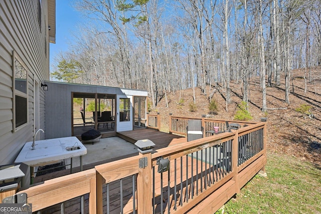 wooden terrace featuring a sunroom