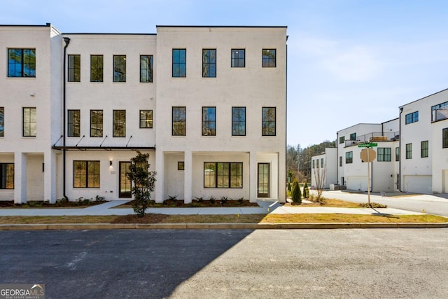 multi unit property featuring stucco siding