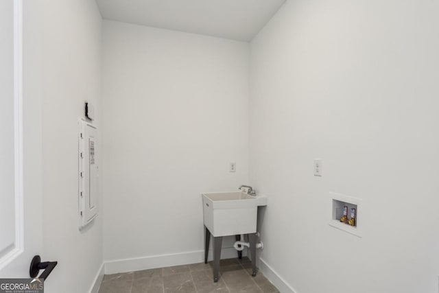 washroom featuring washer hookup, laundry area, electric panel, and baseboards