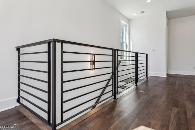 stairway with visible vents, recessed lighting, baseboards, and wood finished floors