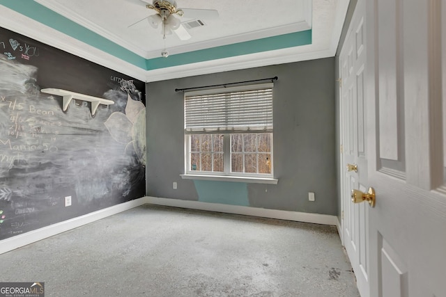 spare room with visible vents, ceiling fan, crown molding, and baseboards