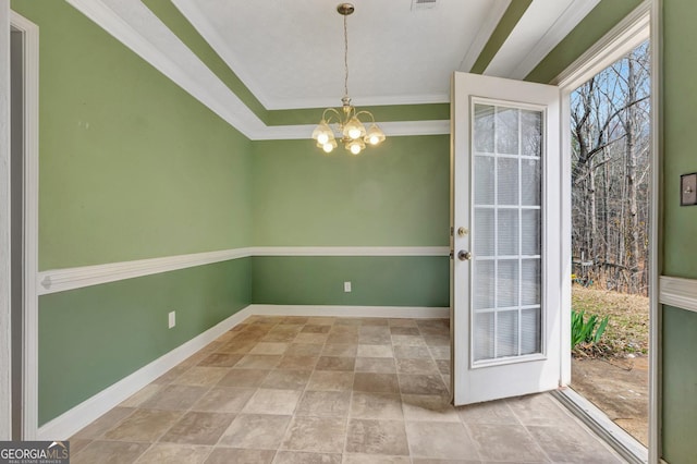 interior space featuring crown molding, visible vents, baseboards, and a chandelier