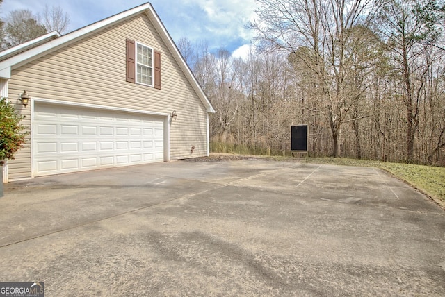 view of side of home featuring a garage