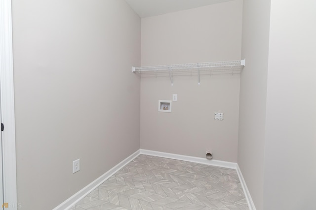 laundry room with laundry area, hookup for a washing machine, baseboards, and hookup for an electric dryer