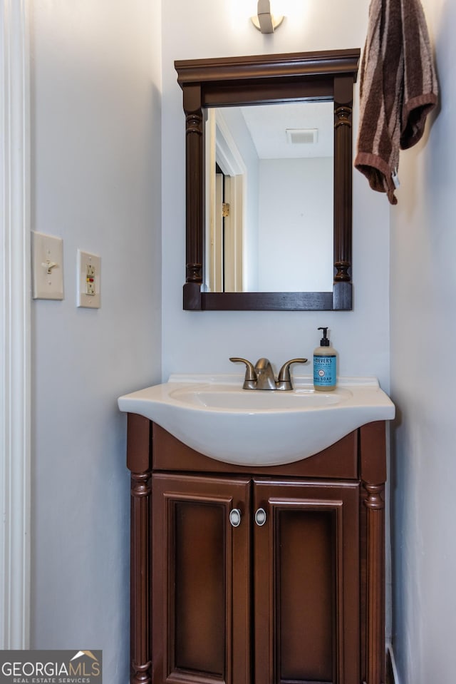 bathroom with visible vents and vanity