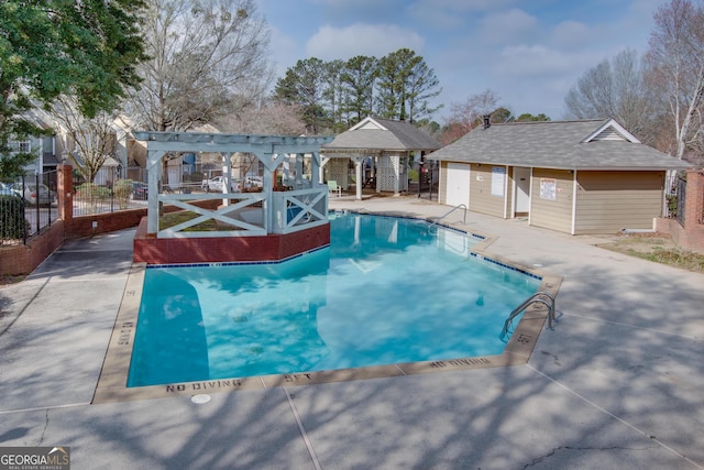 community pool featuring a patio, fence, and a pergola