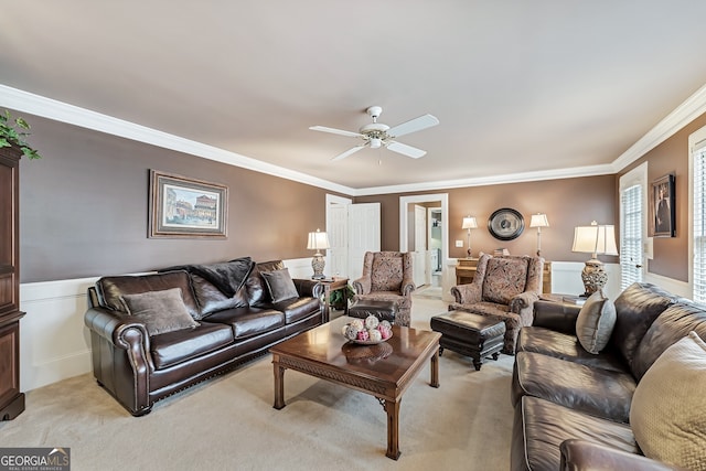 2205 Parliament Dr, Lawrenceville, GA 30043 - living area featuring a ceiling fan, crown molding, wainscoting, and light colored carpet