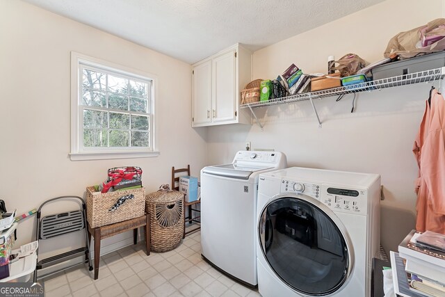 2205 Parliament Dr, Lawrenceville, GA 30043 - washroom featuring independent washer and dryer and cabinet space