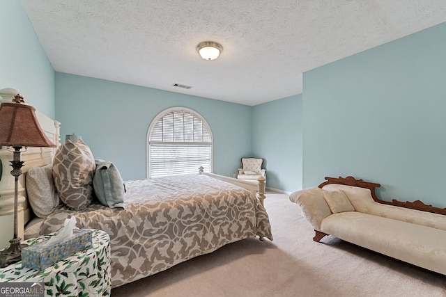 2205 Parliament Dr, Lawrenceville, GA 30043 - carpeted bedroom with a textured ceiling