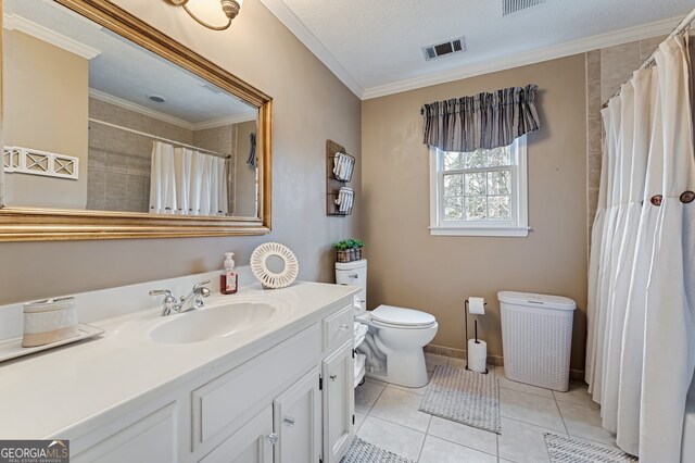 2205 Parliament Dr, Lawrenceville, GA 30043 - full bath featuring vanity, toilet, ornamental molding, tile patterned flooring, and a shower with curtain