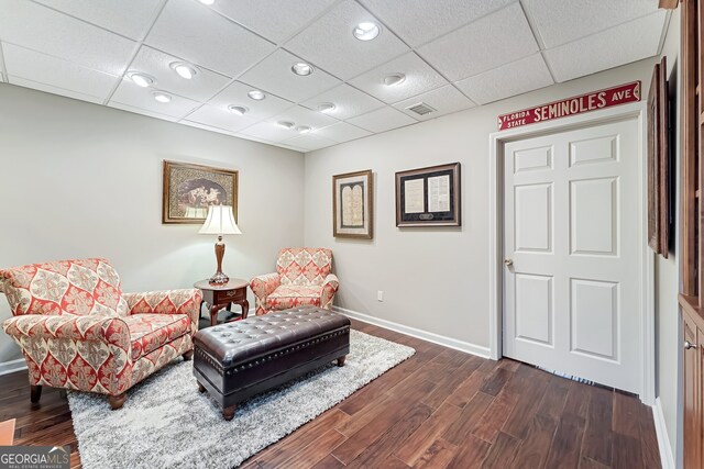 2205 Parliament Dr, Lawrenceville, GA 30043 - living area with dark wood-type flooring, baseboards, recessed lighting, and a paneled ceiling