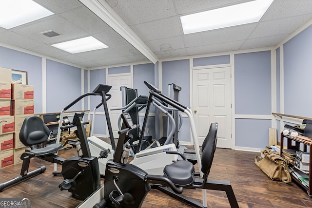 2205 Parliament Dr, Lawrenceville, GA 30043 - workout room featuring a decorative wall, a drop ceiling, and wood finished floors