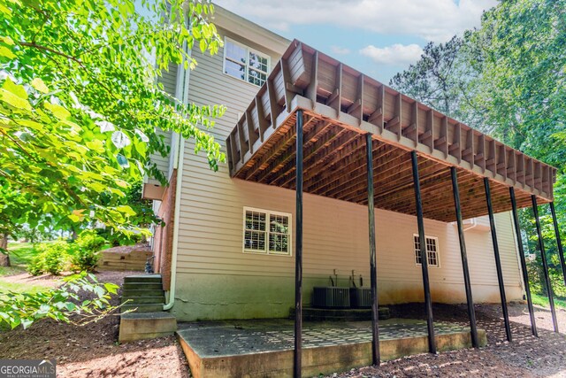 2205 Parliament Dr, Lawrenceville, GA 30043 - view of side of property featuring central AC unit