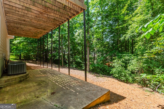 2205 Parliament Dr, Lawrenceville, GA 30043 - view of yard featuring central air condition unit and a patio