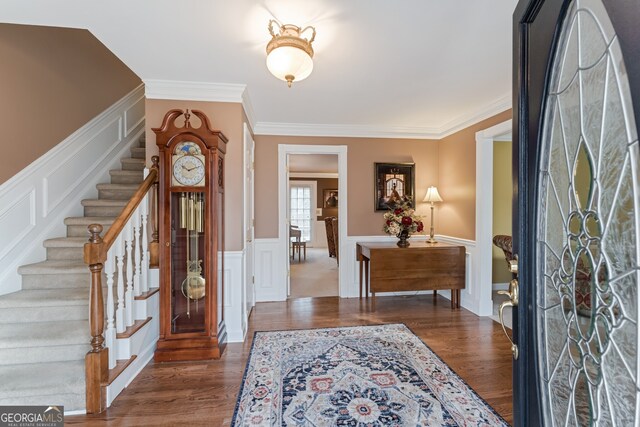 2205 Parliament Dr, Lawrenceville, GA 30043 - entrance foyer featuring stairway, ornamental molding, wood finished floors, a wainscoted wall, and a decorative wall