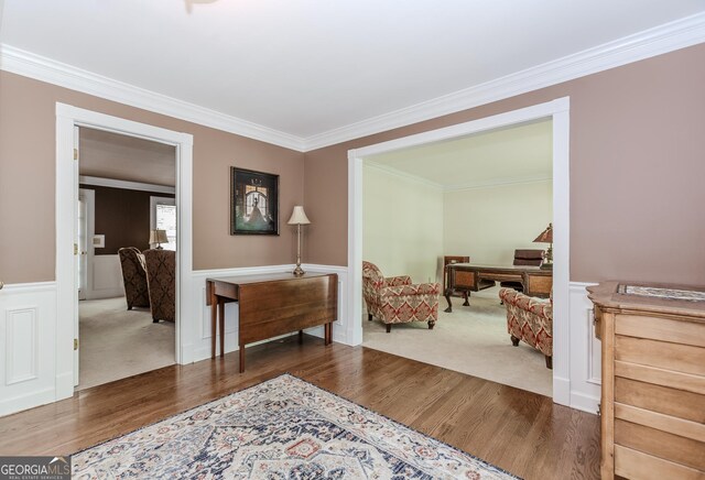 2205 Parliament Dr, Lawrenceville, GA 30043 - sitting room with wood finished floors, ornamental molding, wainscoting, and carpet flooring
