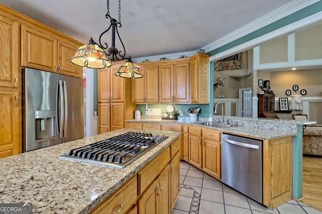 kitchen with crown molding, light stone countertops, light tile patterned floors, stainless steel appliances, and a sink