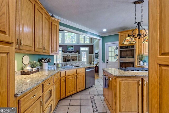 kitchen with light tile patterned floors, a peninsula, a sink, appliances with stainless steel finishes, and crown molding