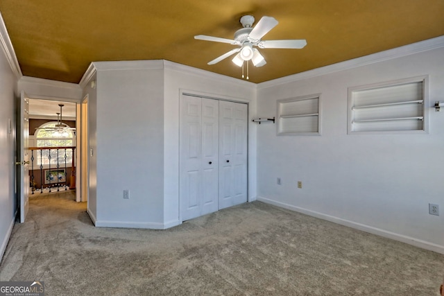 unfurnished bedroom featuring baseboards, carpet, and ornamental molding